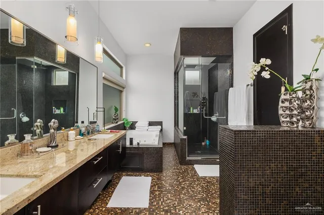 a bathroom with a double vanity sink and a mirror