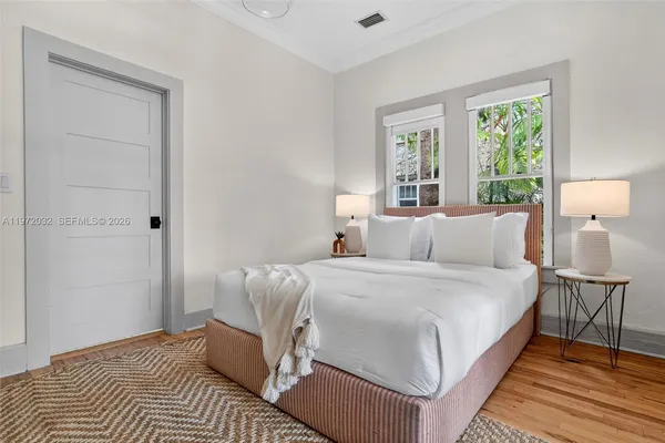 a view of a patio with table and chairs with wooden floor and fence
