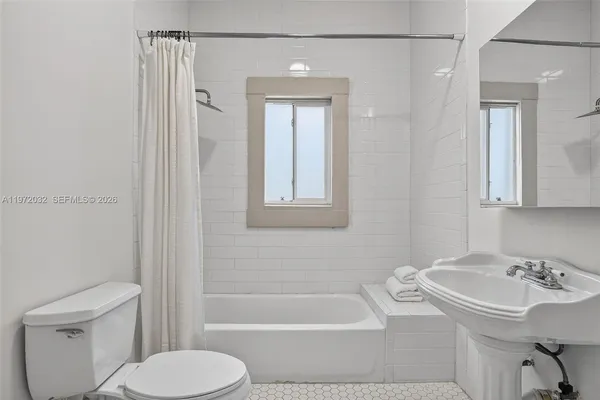 an aerial view of a house with a yard and garden