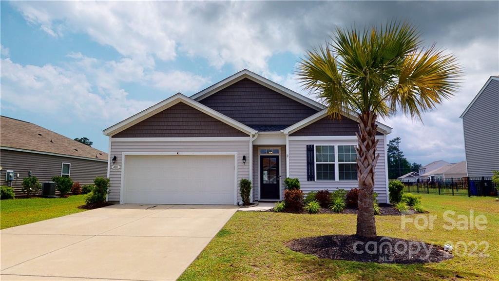 408 Accord Street Myrtle Beach, SC 29588 - Photo 1 of 43 a front view of a house with garden