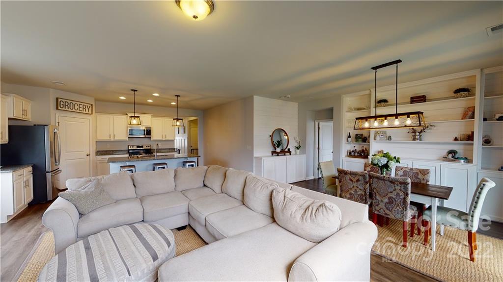 408 Accord Street Myrtle Beach, SC 29588 - Photo 20 of 43 a living room with furniture and kitchen view