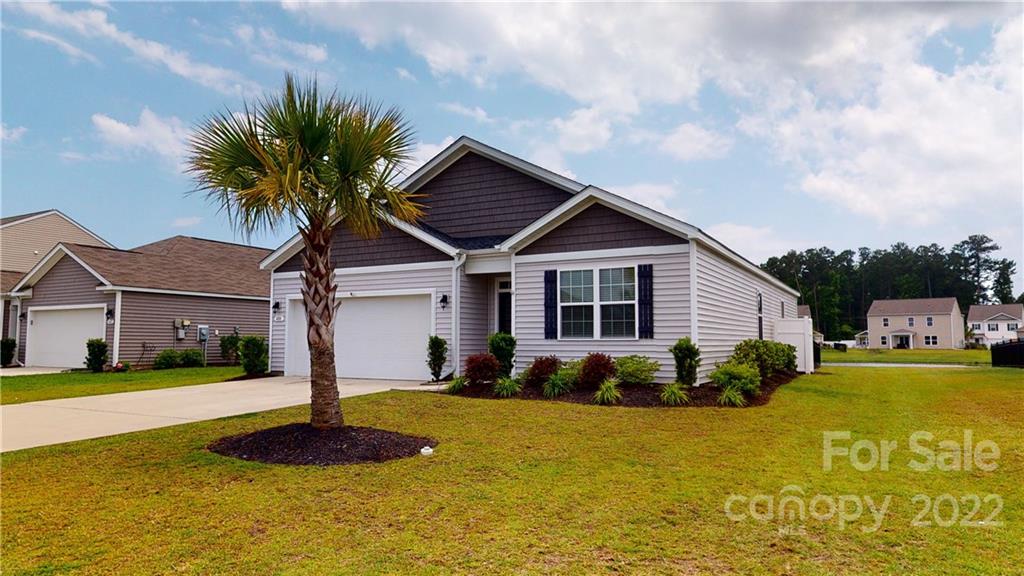 408 Accord Street Myrtle Beach, SC 29588 - Photo 2 of 43 a front view of house with yard and swimming pool