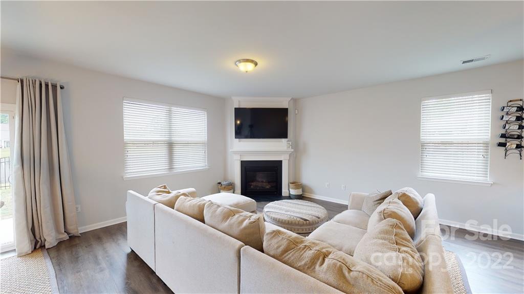 408 Accord Street Myrtle Beach, SC 29588 - Photo 21 of 43 a living room with furniture window and a fireplace
