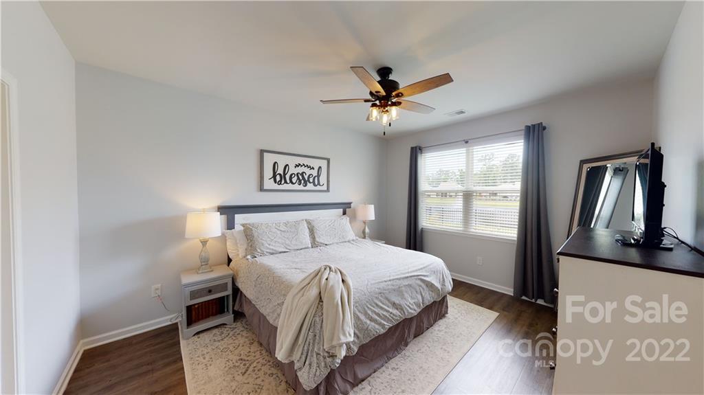 408 Accord Street Myrtle Beach, SC 29588 - Photo 28 of 43 a bedroom with a large bed and a window