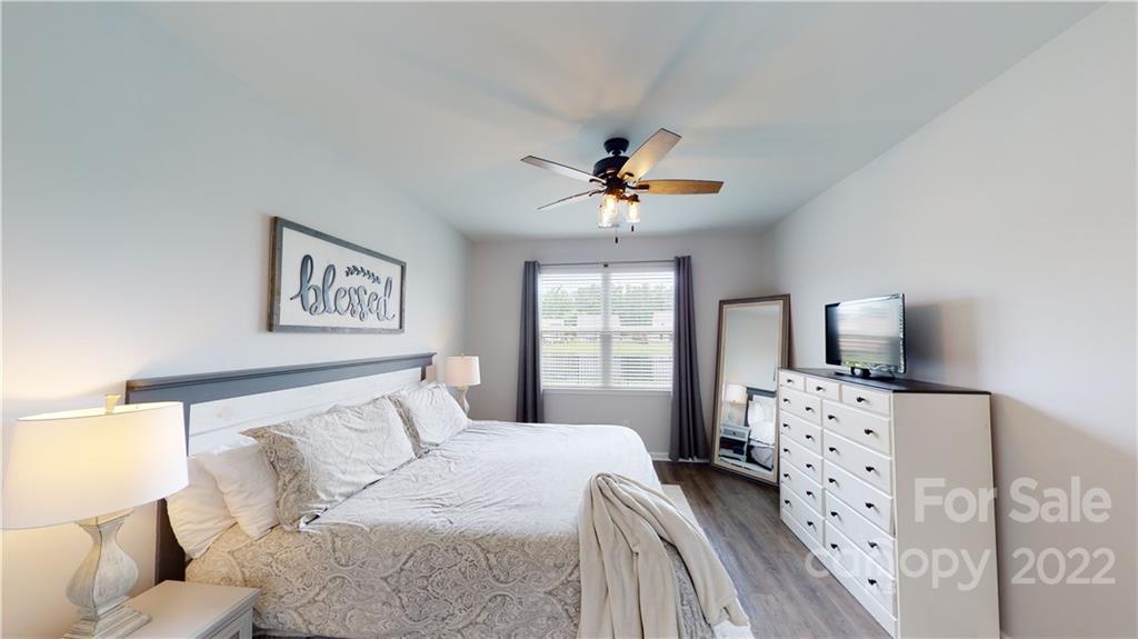 408 Accord Street Myrtle Beach, SC 29588 - Photo 29 of 43 a bedroom with a bed and a tv