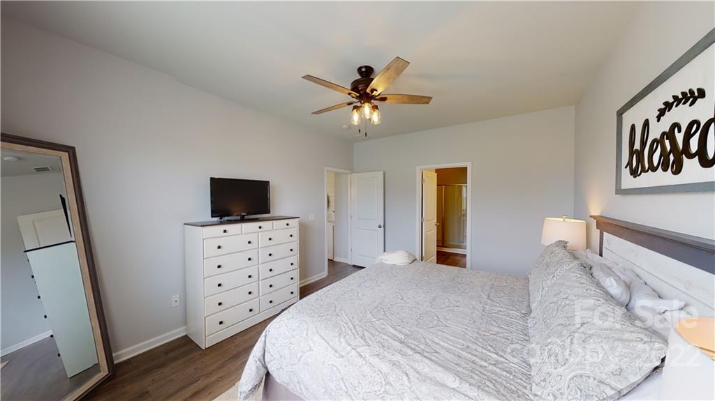 408 Accord Street Myrtle Beach, SC 29588 - Photo 30 of 43 a bedroom with a bed and a flat screen tv