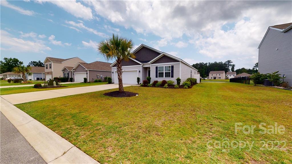408 Accord Street Myrtle Beach, SC 29588 - Photo 38 of 43 a front view of house with yard and swimming pool
