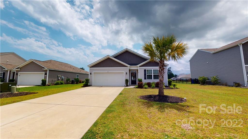 408 Accord Street Myrtle Beach, SC 29588 - Photo 39 of 43 a front view of a house with a yard