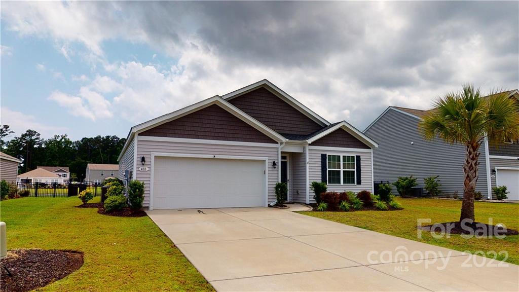 408 Accord Street Myrtle Beach, SC 29588 - Photo 41 of 43 a front view of house with yard and green space