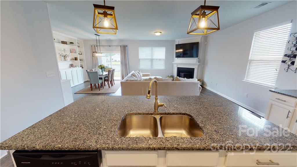 408 Accord Street Myrtle Beach, SC 29588 - Photo 10 of 43 a kitchen with granite countertop a sink a counter top space and appliances