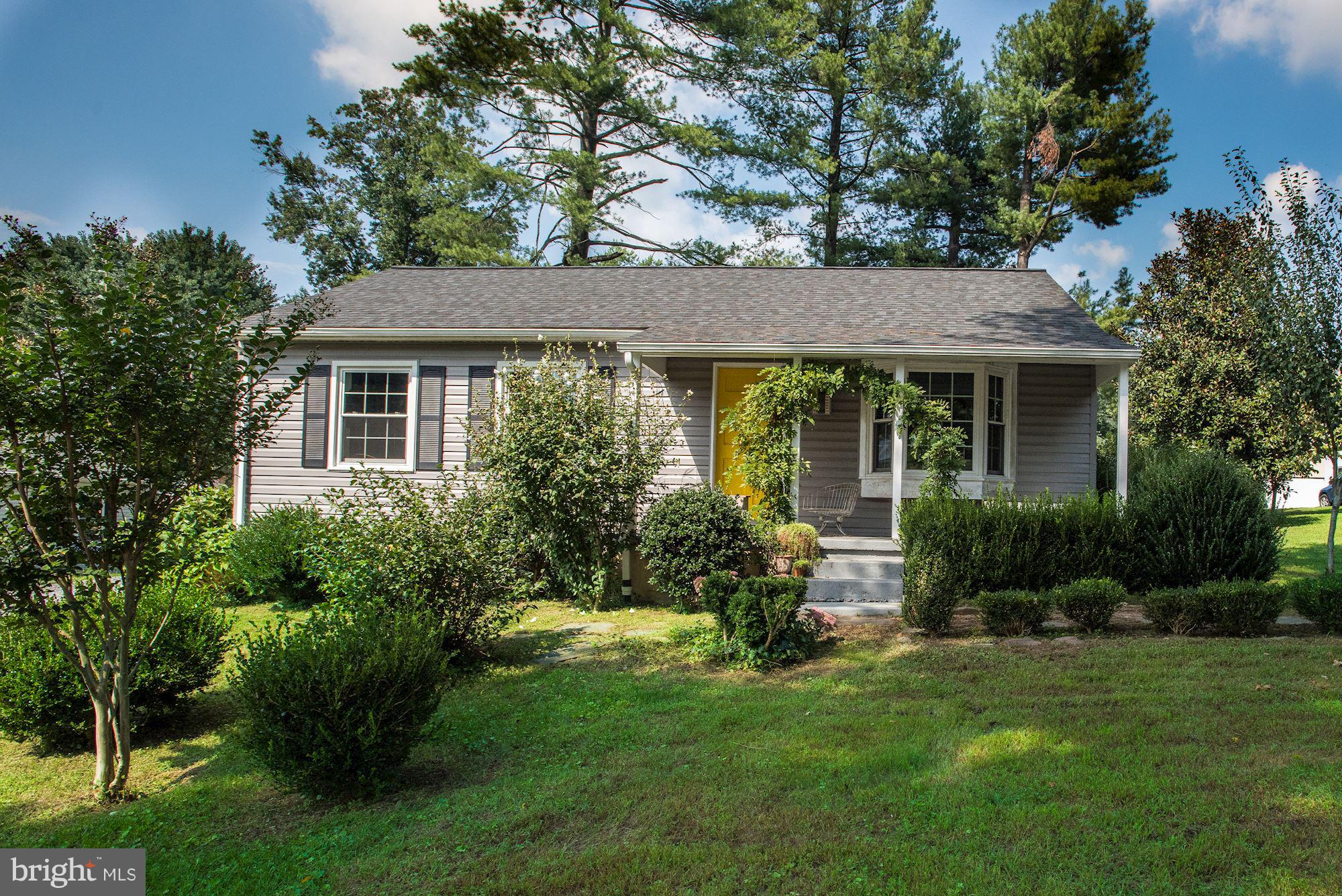 800 Blue Ridge Avenue Middleburg, VA 20117 - Photo 13 of 19 a view of a house with a yard and potted plants