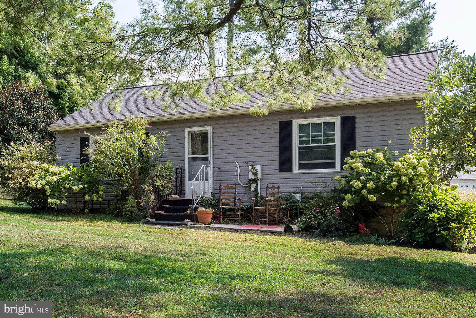 800 Blue Ridge Avenue Middleburg, VA 20117 - Photo 17 of 19 a front view of house with yard and green space