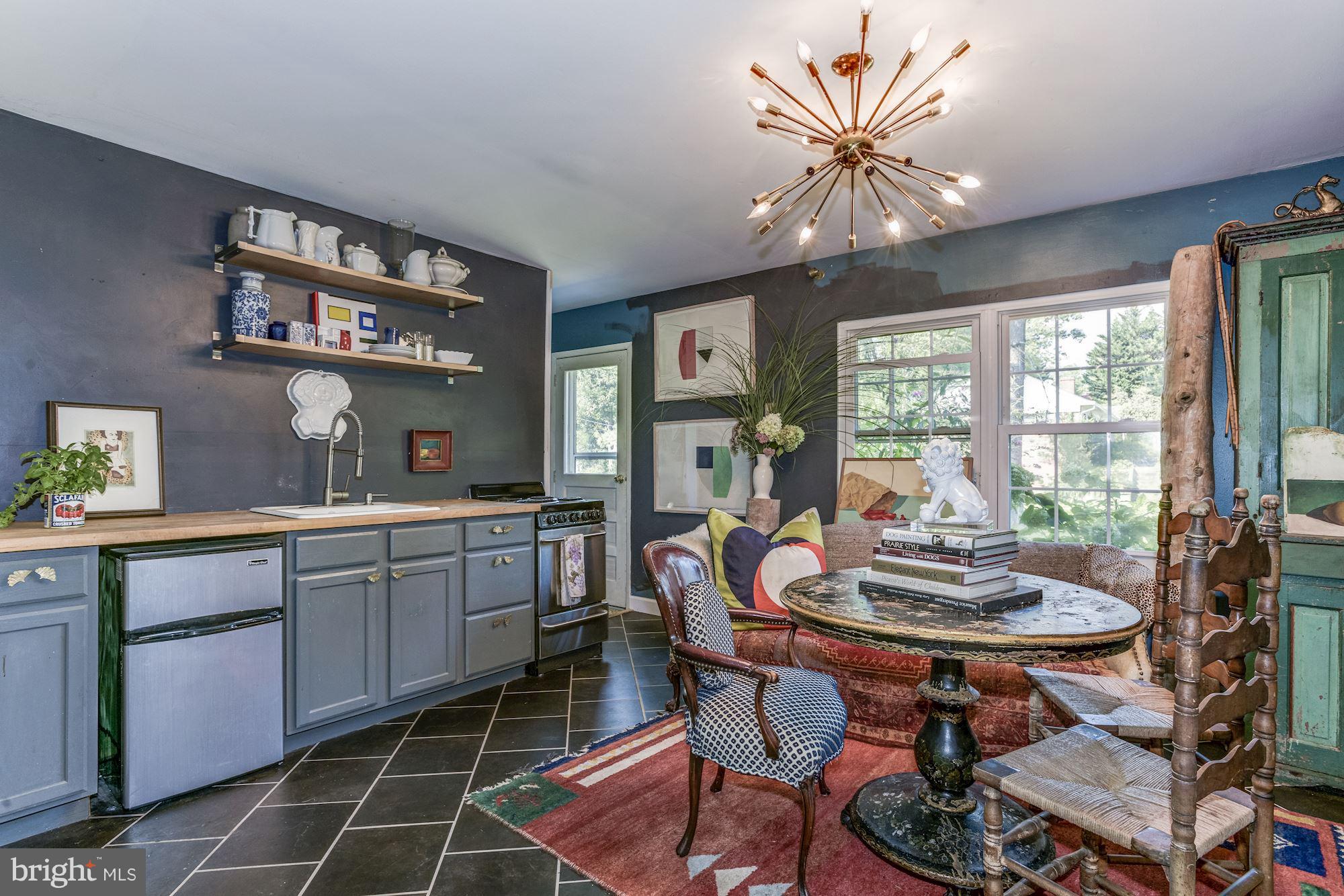 800 Blue Ridge Avenue Middleburg, VA 20117 - Photo 7 of 19 a kitchen with a dining table and chairs
