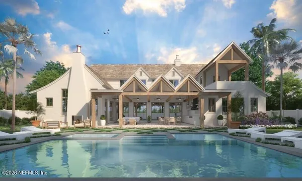 a view of house with pool and chairs