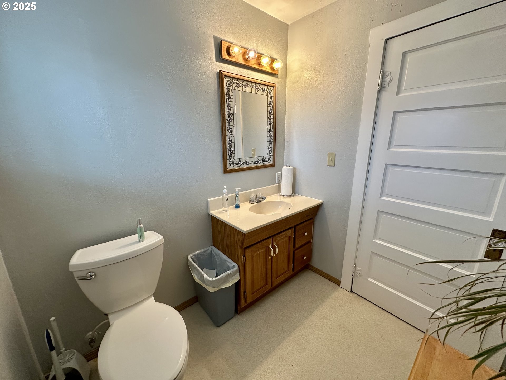 83 Swain Lane Eugene, OR 97404 - Photo 12 of 23 a bathroom with a toilet sink and mirror