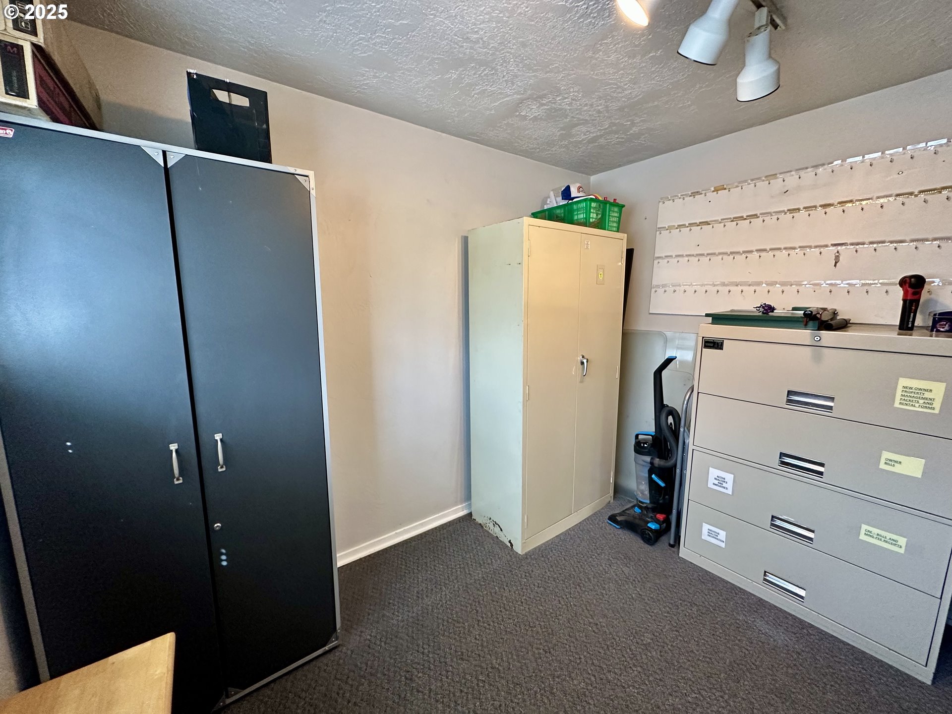 83 Swain Lane Eugene, OR 97404 - Photo 14 of 23 a view of a closet area with ceiling fan