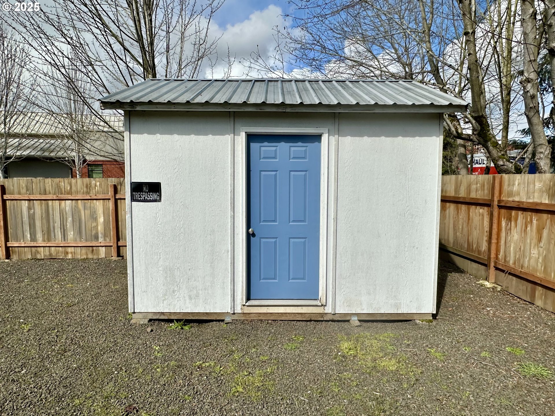 83 Swain Lane Eugene, OR 97404 - Photo 21 of 23 a front view of a house with a wooden fence