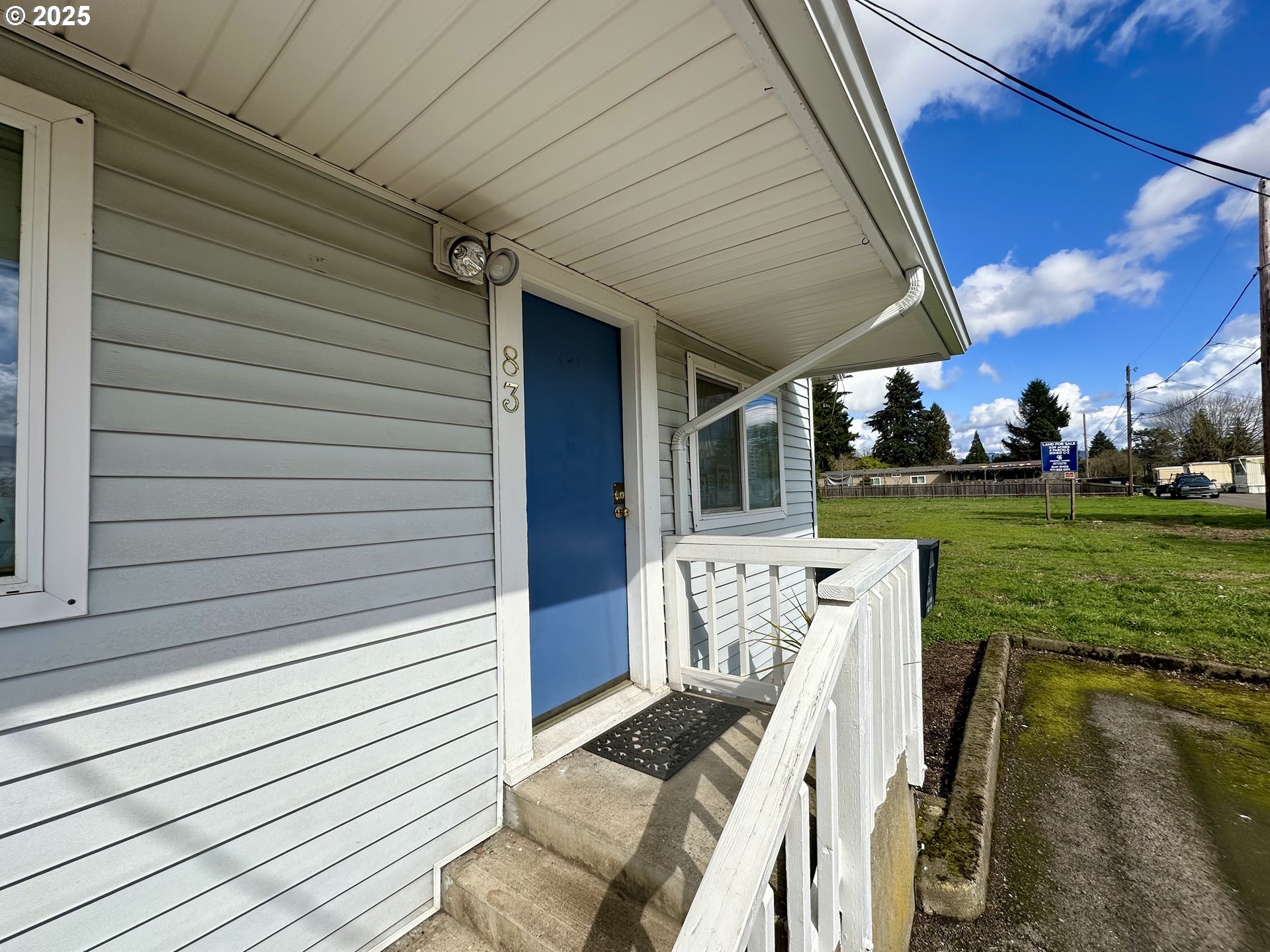 83 Swain Lane Eugene, OR 97404 - Photo 4 of 23 a view of a patio with table and chairs potted plants with wooden floor
