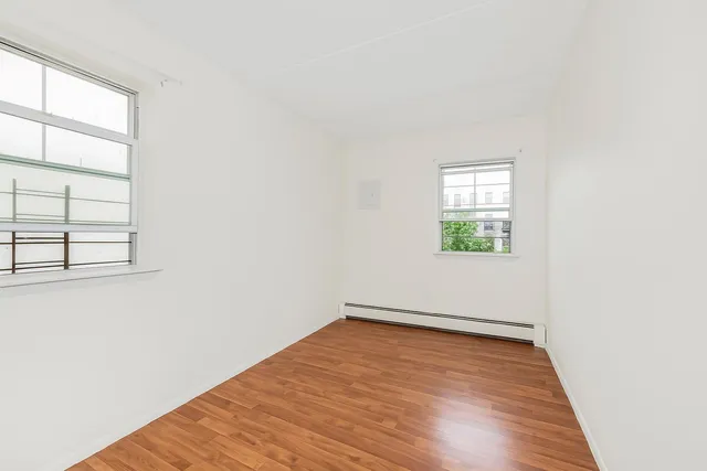 a view of a small space with wooden floor