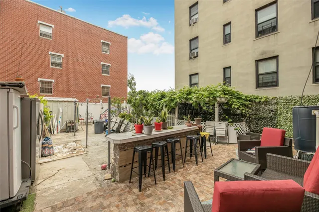 a outdoor space with patio the couches and a dining table with chairs