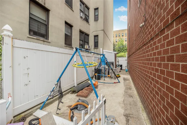 a utility room with multiple dryer and washer