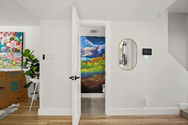 a view of a hallway with paintings on the wall
