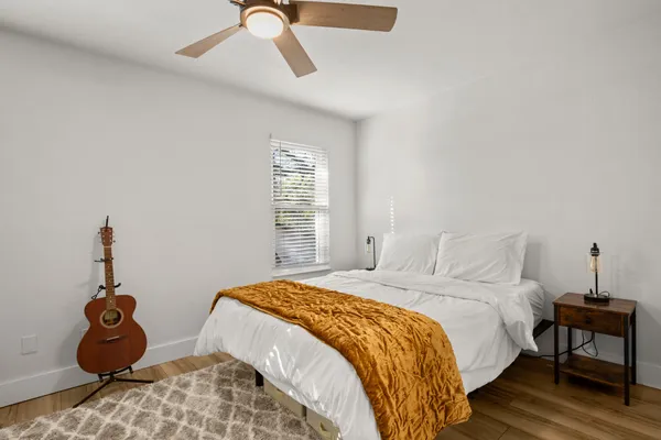 a bedroom with a bed and a window