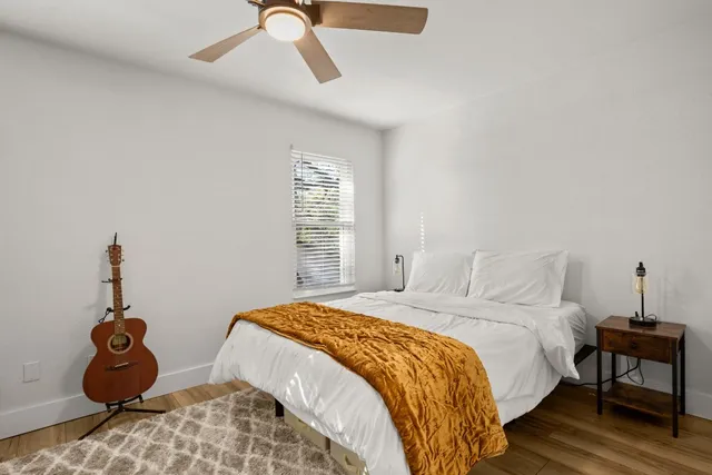 a bedroom with a bed and a window