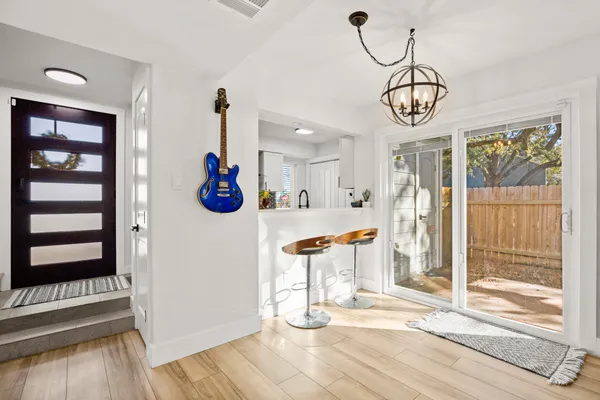 a view of a room with wooden floor and window