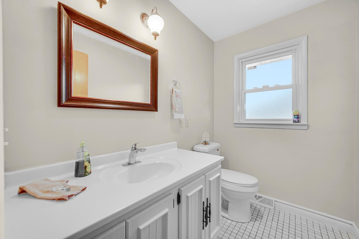 3508 Highway 20 Rolling Prairie, IN 46371 - Photo 15 of 29 a bathroom with a toilet sink and mirror