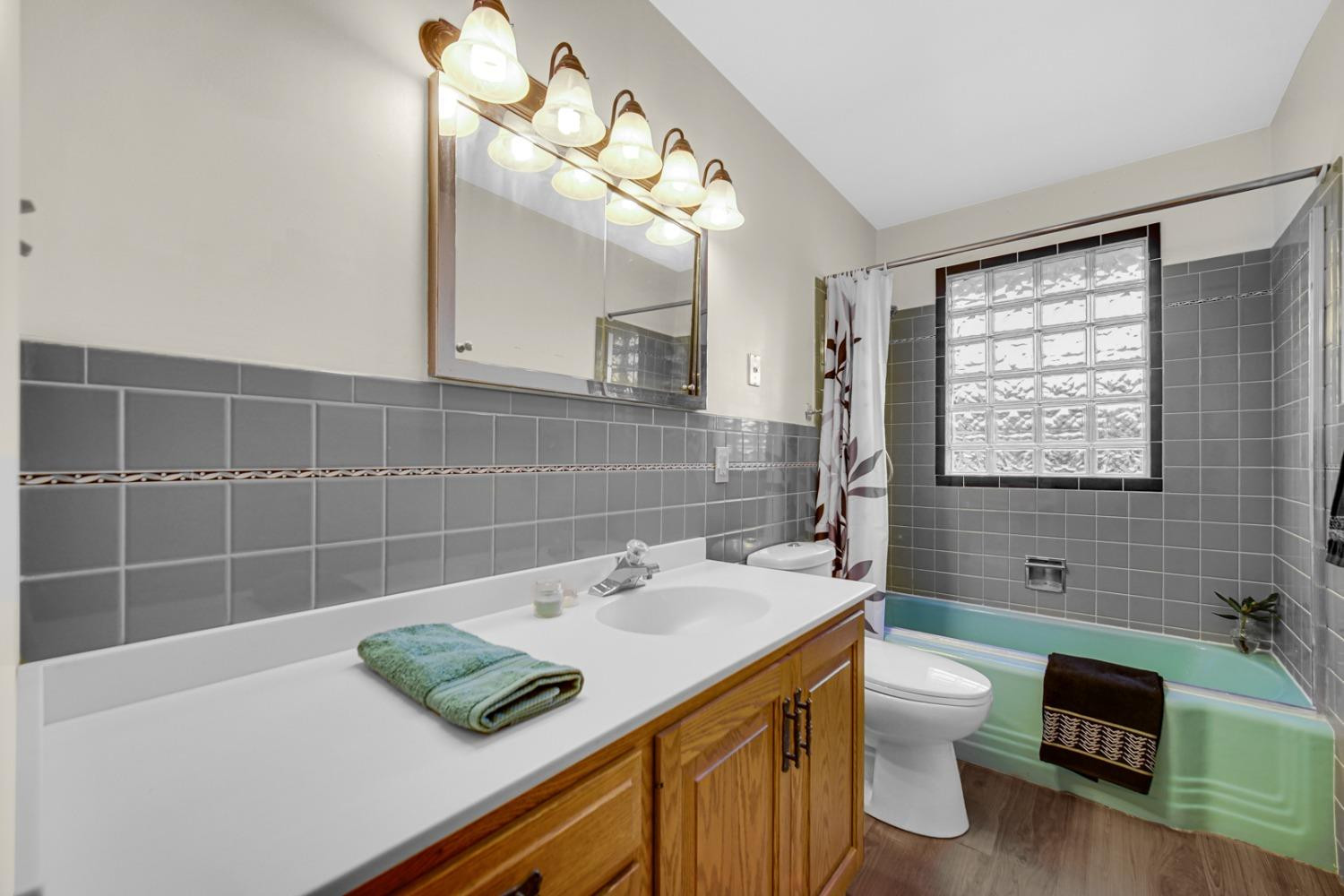 3508 Highway 20 Rolling Prairie, IN 46371 - Photo 16 of 29 a bathroom with a sink a toilet and mirror