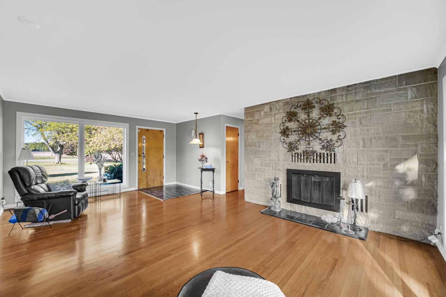 3508 Highway 20 Rolling Prairie, IN 46371 - Photo 5 of 29 a living room with furniture and a fireplace