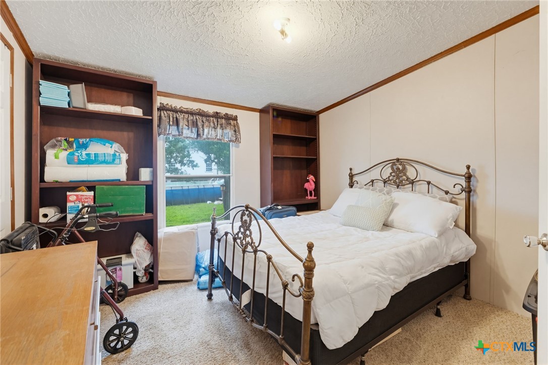 164 County Road 4450 Kempner, TX 76539 - Photo 21 of 44 a bedroom with a bed and a large window with the outer view
