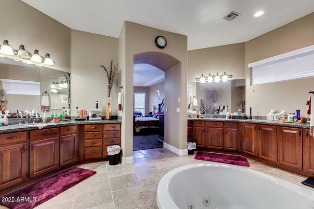 a large bathroom with double vanity sink and a mirror