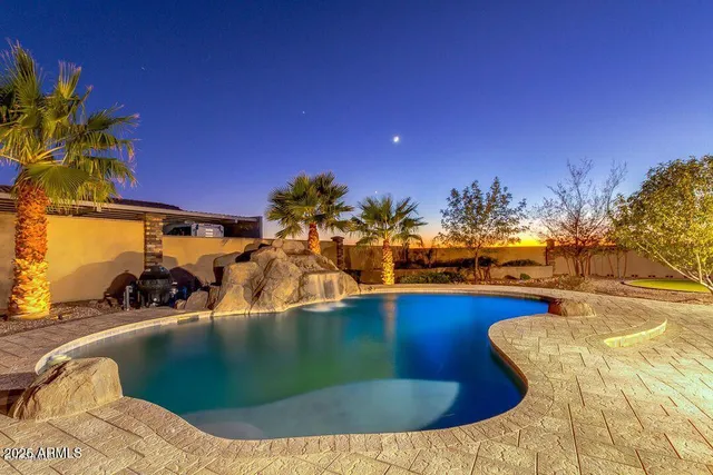 a view of a swimming pool with seating area
