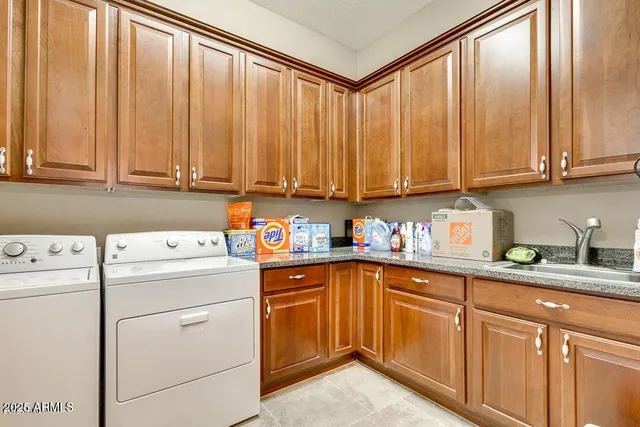 a view of a kitchen with sink and cabinets