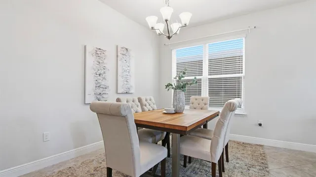 a view of a dining room with furniture and window