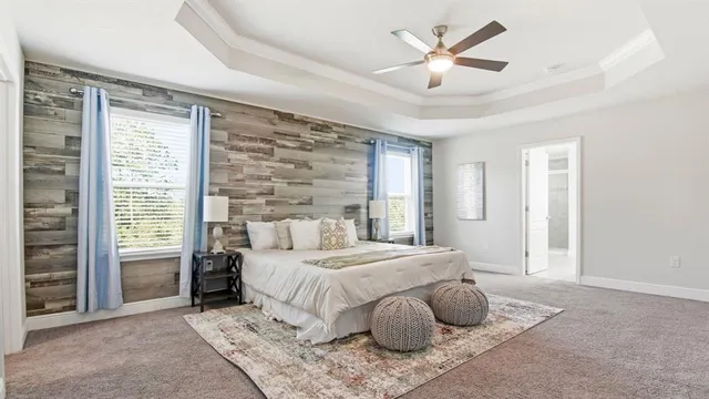 a bedroom with a large bed and a large window