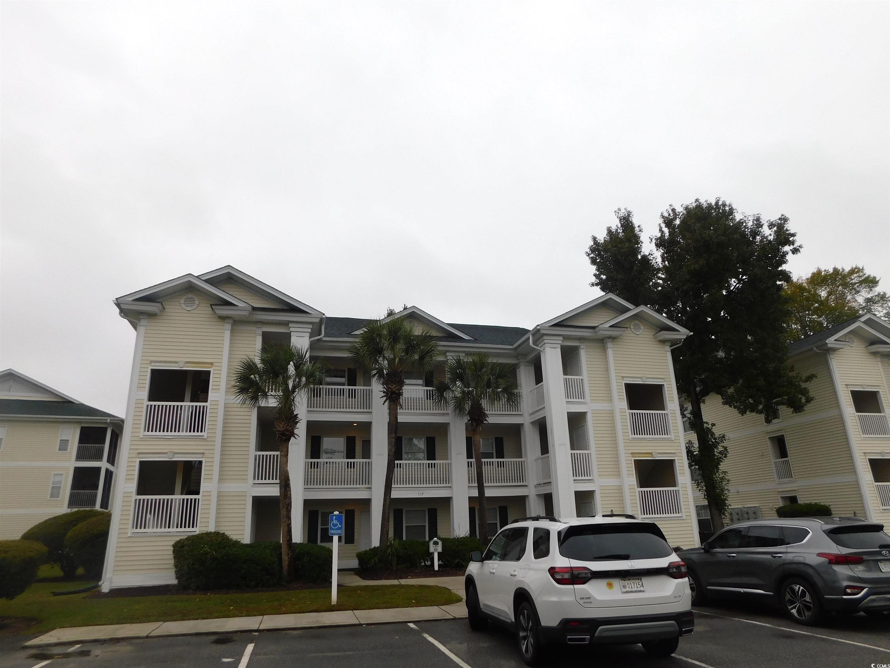 517 White River Drive, Unit BUILDING 22 G Myrtle Beach, SC 29579 - Photo 1 of 17 View of building exterior with uncovered parking