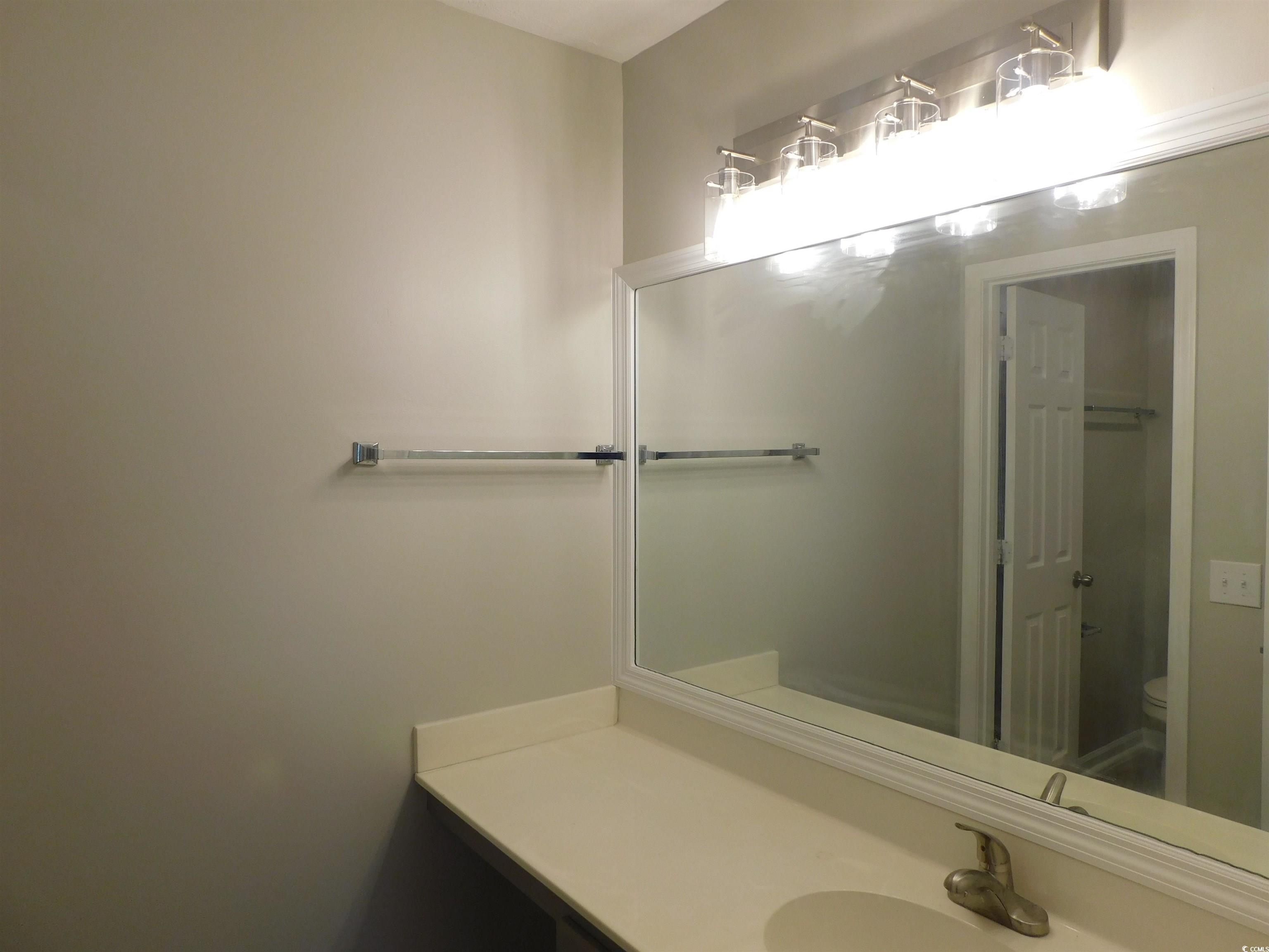 517 White River Drive, Unit BUILDING 22 G Myrtle Beach, SC 29579 - Photo 12 of 17 Unfurnished room featuring light wood-style floors and ceiling fan