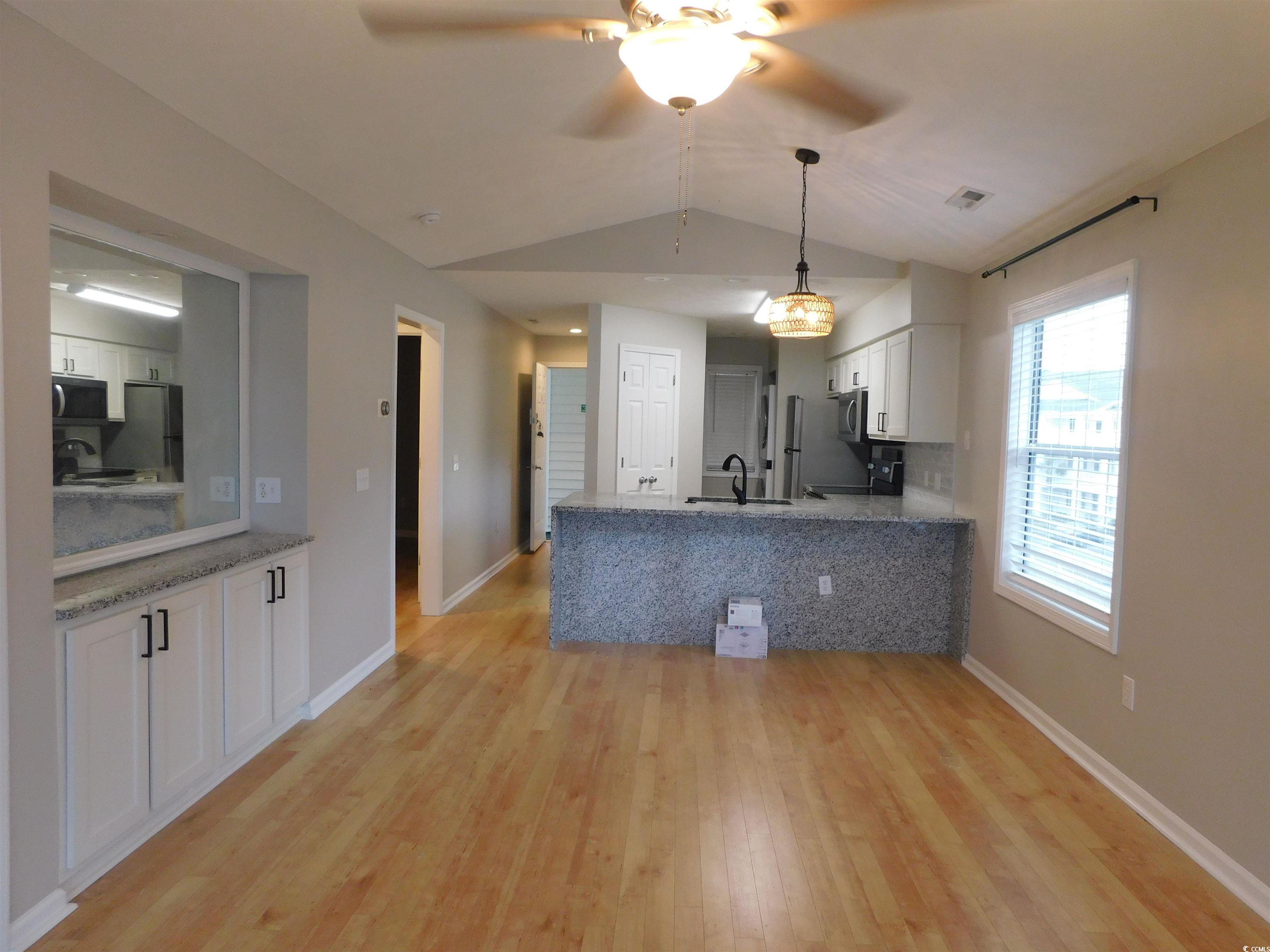 517 White River Drive, Unit BUILDING 22 G Myrtle Beach, SC 29579 - Photo 10 of 17 View of grassy yard