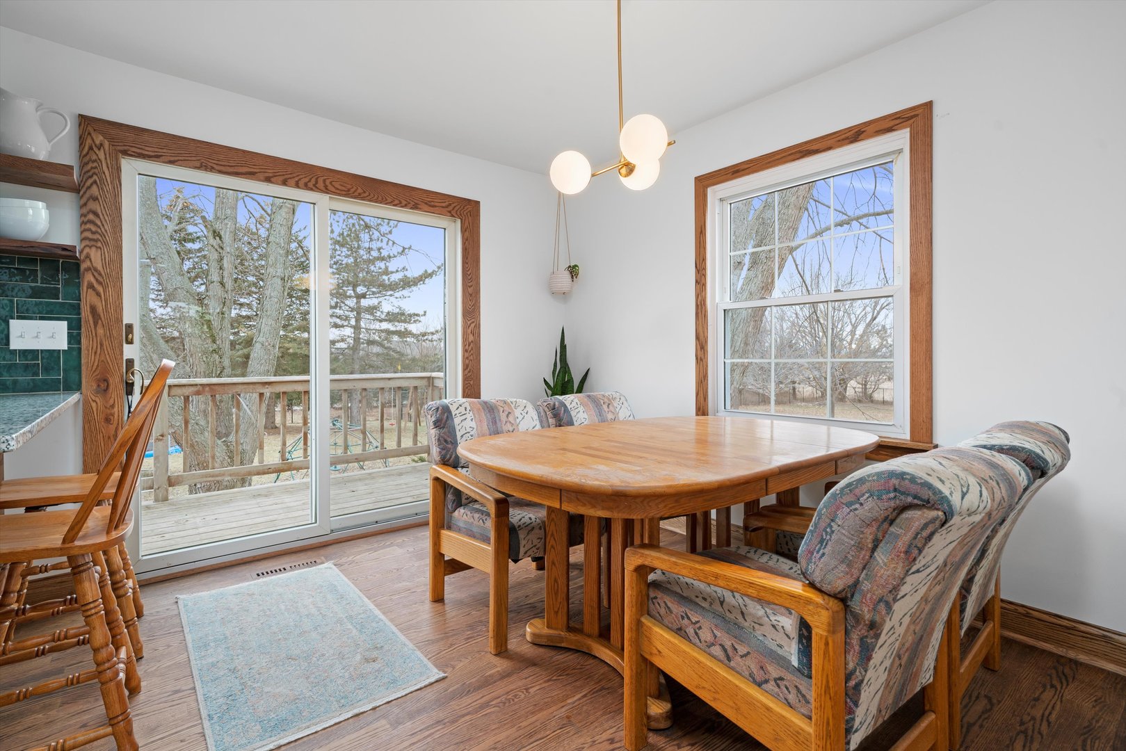 21204 South Pfeiffer Road Frankfort, IL 60423 - Photo 11 of 45 a dining room with furniture and wooden floor