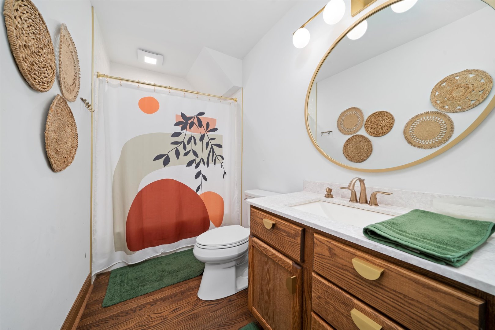 21204 South Pfeiffer Road Frankfort, IL 60423 - Photo 13 of 45 a bathroom with a toilet sink and mirror