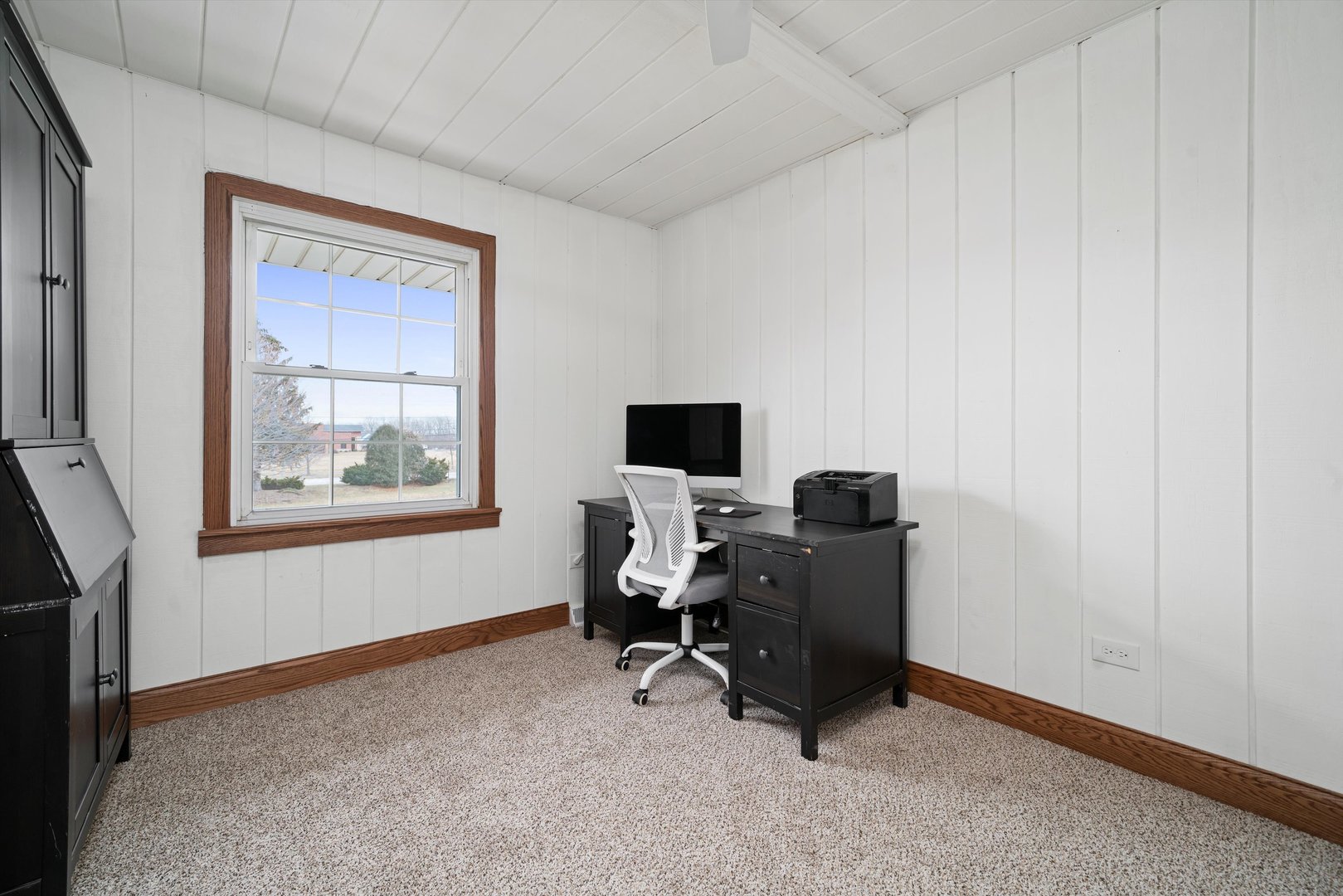 21204 South Pfeiffer Road Frankfort, IL 60423 - Photo 15 of 45 a view of a workspace with furniture and a window