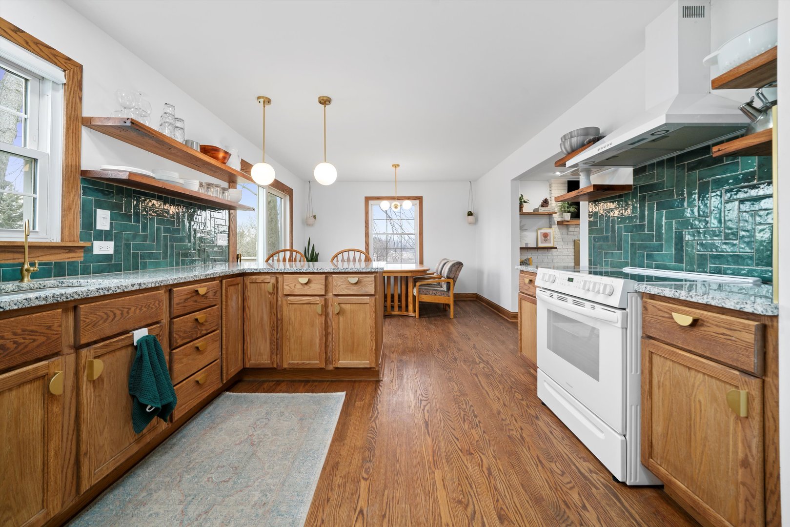 21204 South Pfeiffer Road Frankfort, IL 60423 - Photo 6 of 45 an open kitchen with a sink and wooden floor