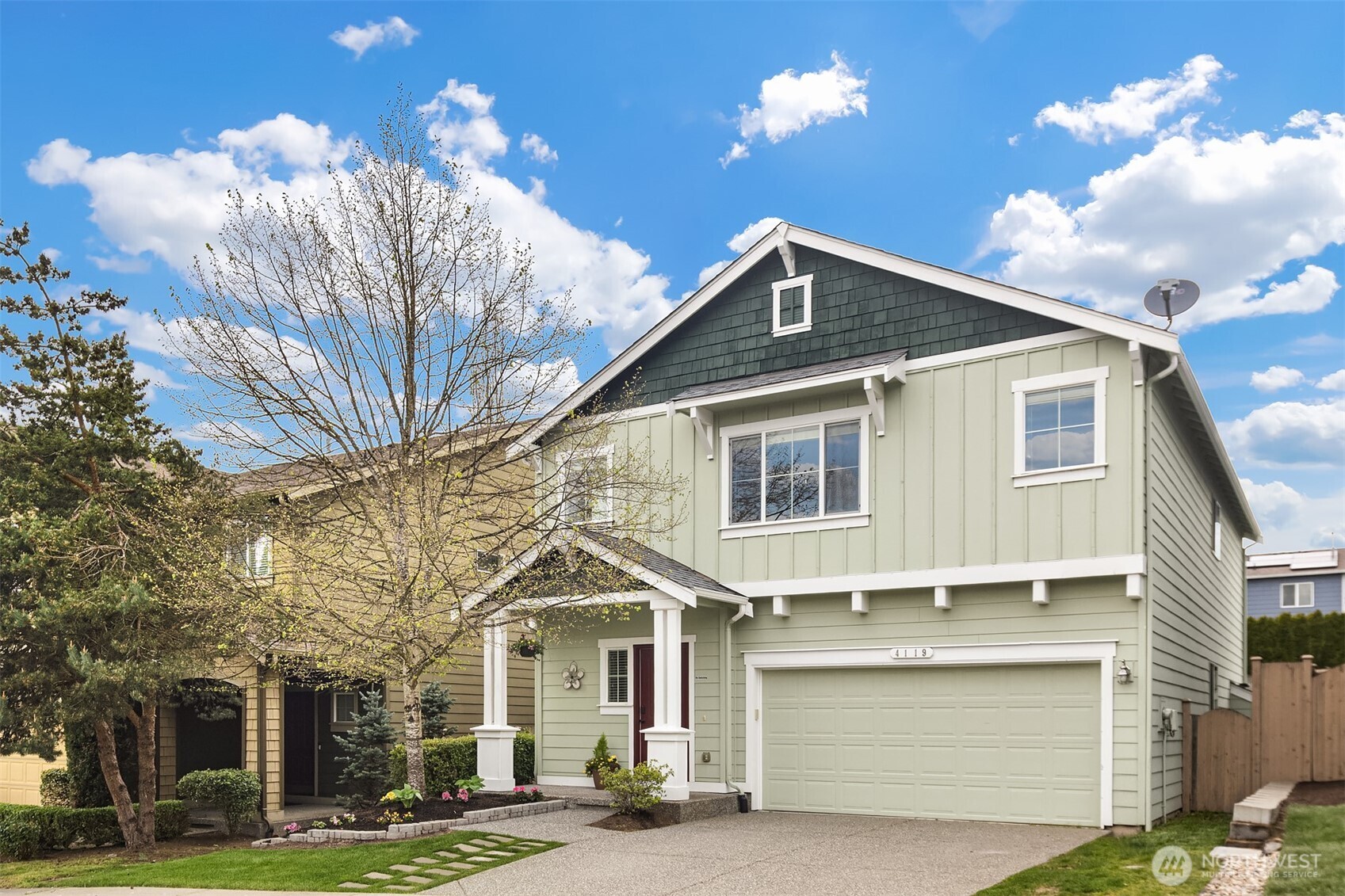4119 167th Place Southeast Bothell, WA 98012 - Photo 4 of 39 a front view of a house with a yard