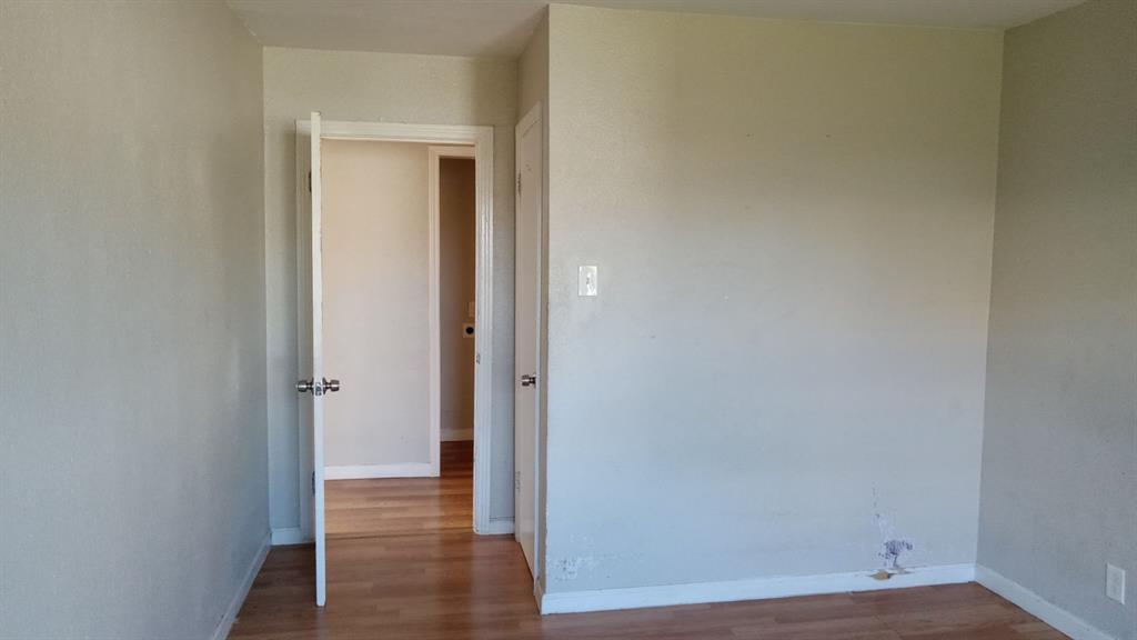 1510 Carson Street Dallas, TX 75216 - Photo 2 of 29 a view of a hallway with wooden floor