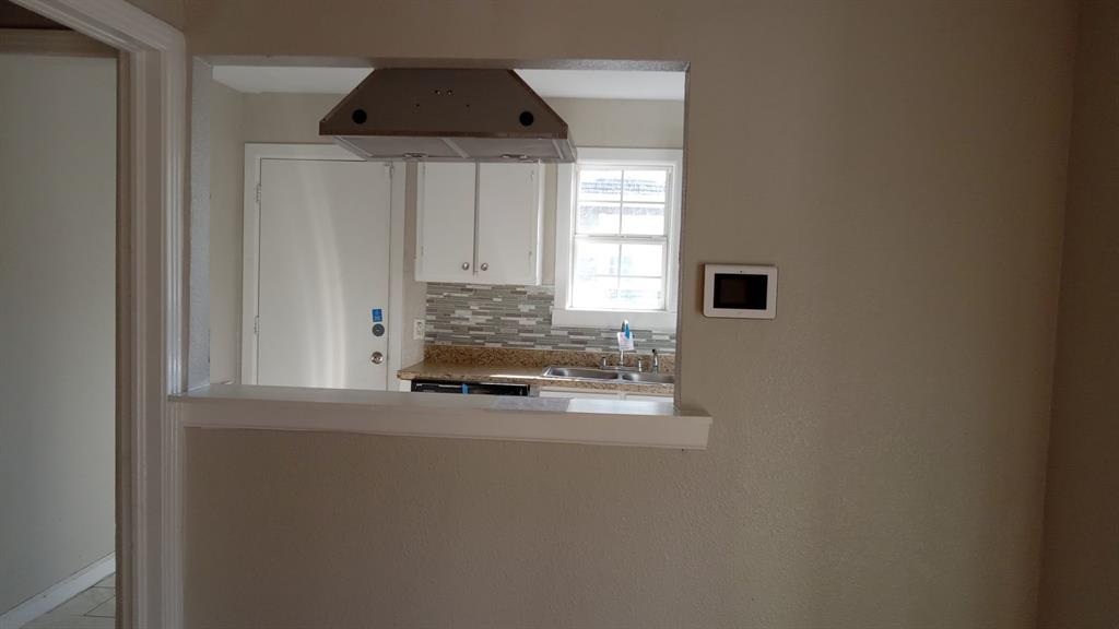 1510 Carson Street Dallas, TX 75216 - Photo 26 of 29 a kitchen with a sink and cabinets