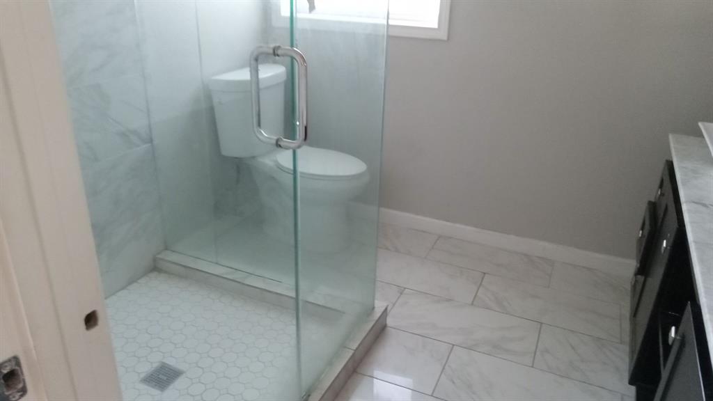 1510 Carson Street Dallas, TX 75216 - Photo 8 of 29 a bathroom with a granite countertop shower