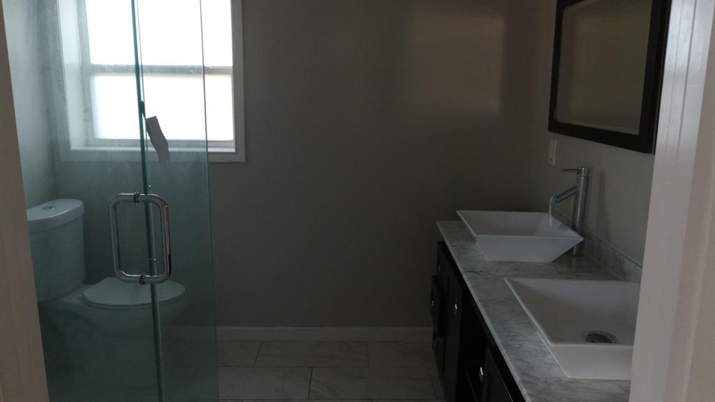 1510 Carson Street Dallas, TX 75216 - Photo 9 of 29 a bathroom with a sink and toilet